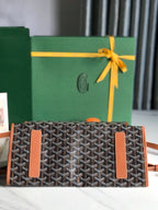 SAINT LÉGER BACKPACK 35 IN BROWN GOYARDINE CANVAS AND CALFSKIN WITH CARTOON PATCH